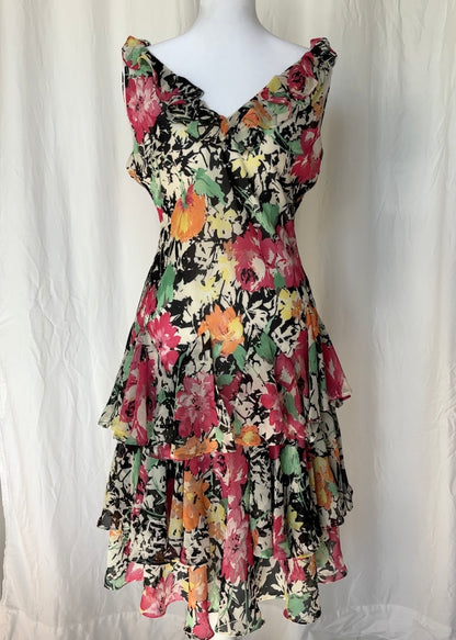 Floral dress on a mannequin against a white background